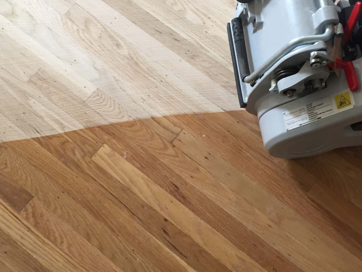 Hardwood floor refinishing process in a Seattle home by LUKS Construction