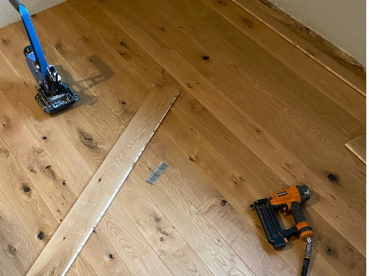 Nail-down engineered hardwood floor installation over plywood subfloor in Bellevue WA