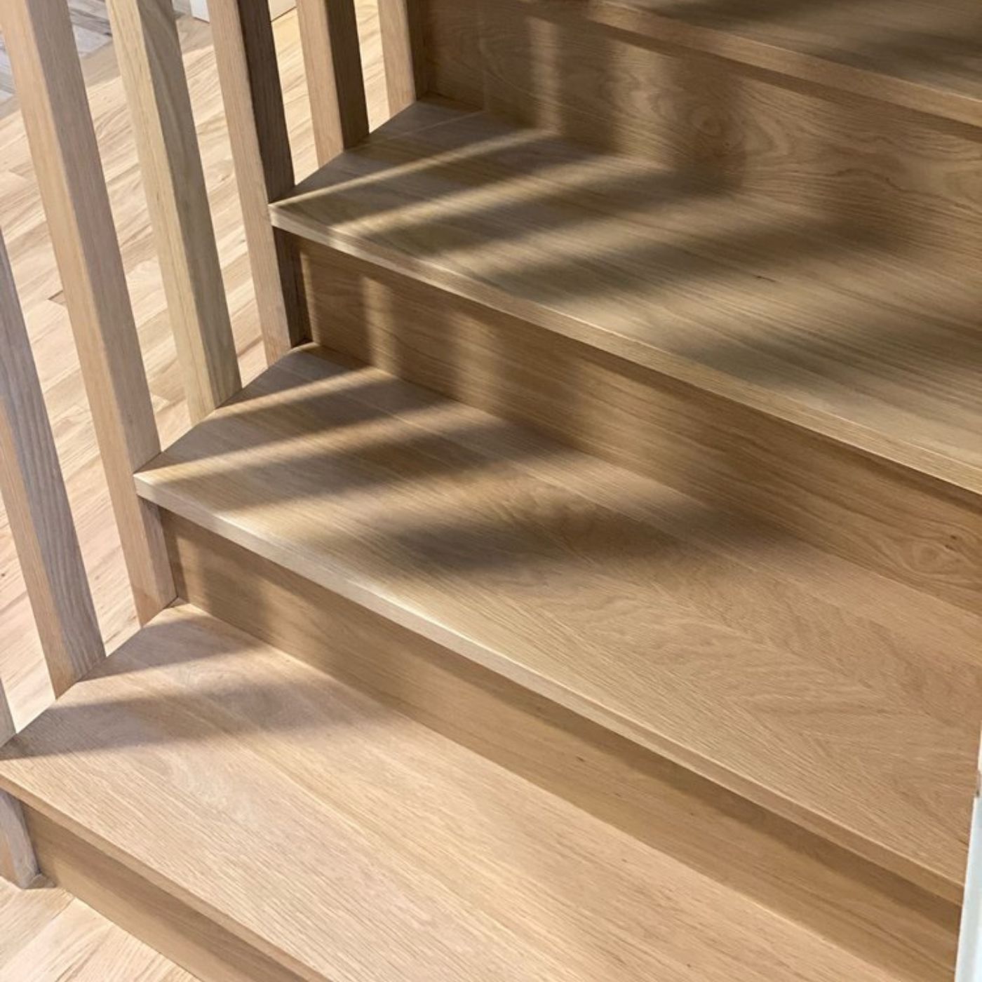 White and red oak hardwood floor refinishing with Bona NaturalSeal and Bona Naturale, plus square-nose white oak stairs by LUKS Construction in the Seattle Bellevue area
