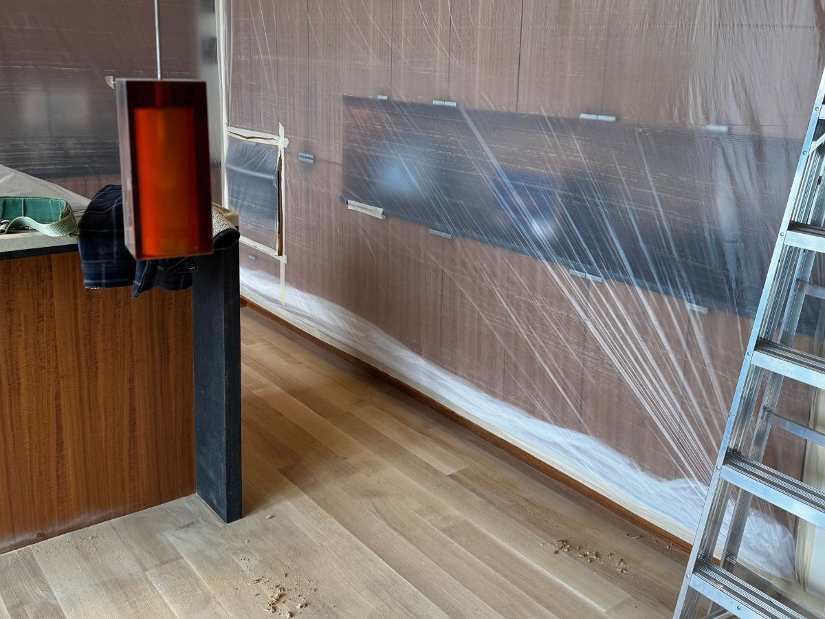 Dust control setup for hardwood floor refinishing in Redmond WA