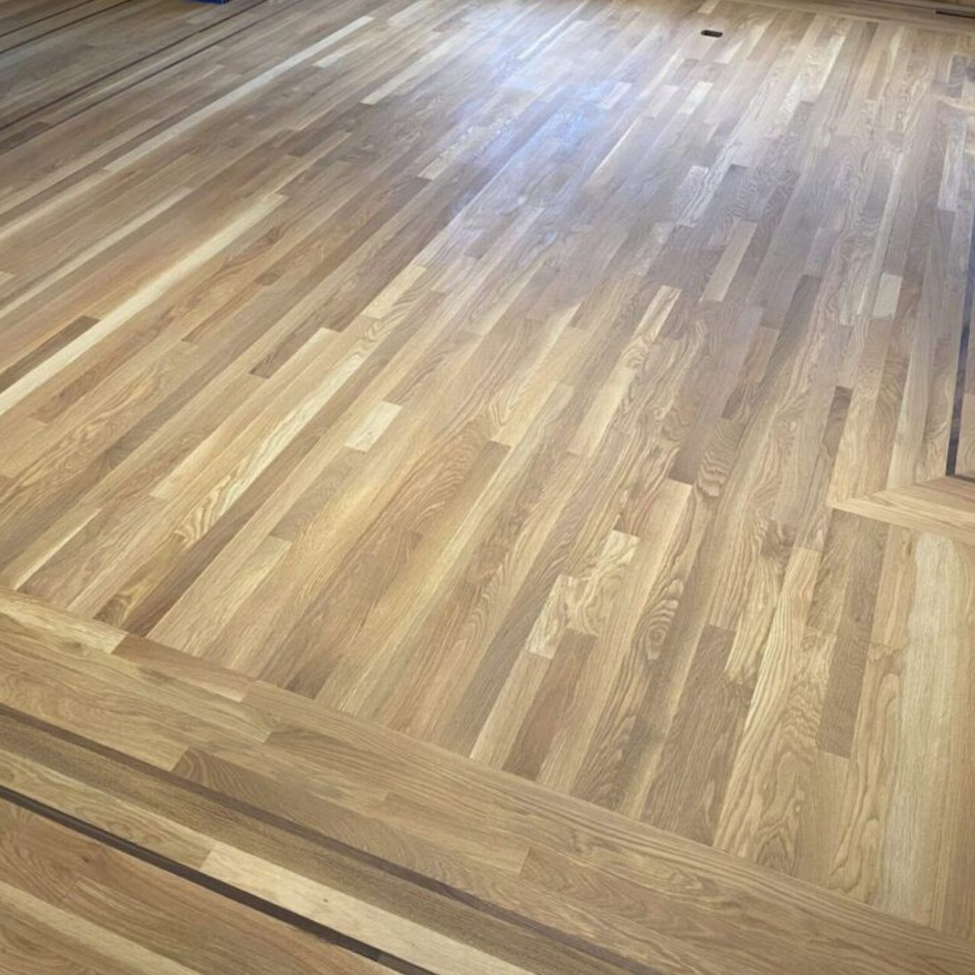 Floor refinishing in Bellevue WA with satin protective finish