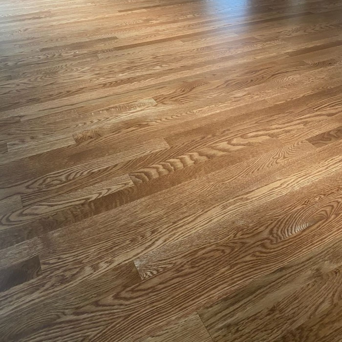 Premium hardwood floor refinishing project in Sammamish WA by LUKS Construction