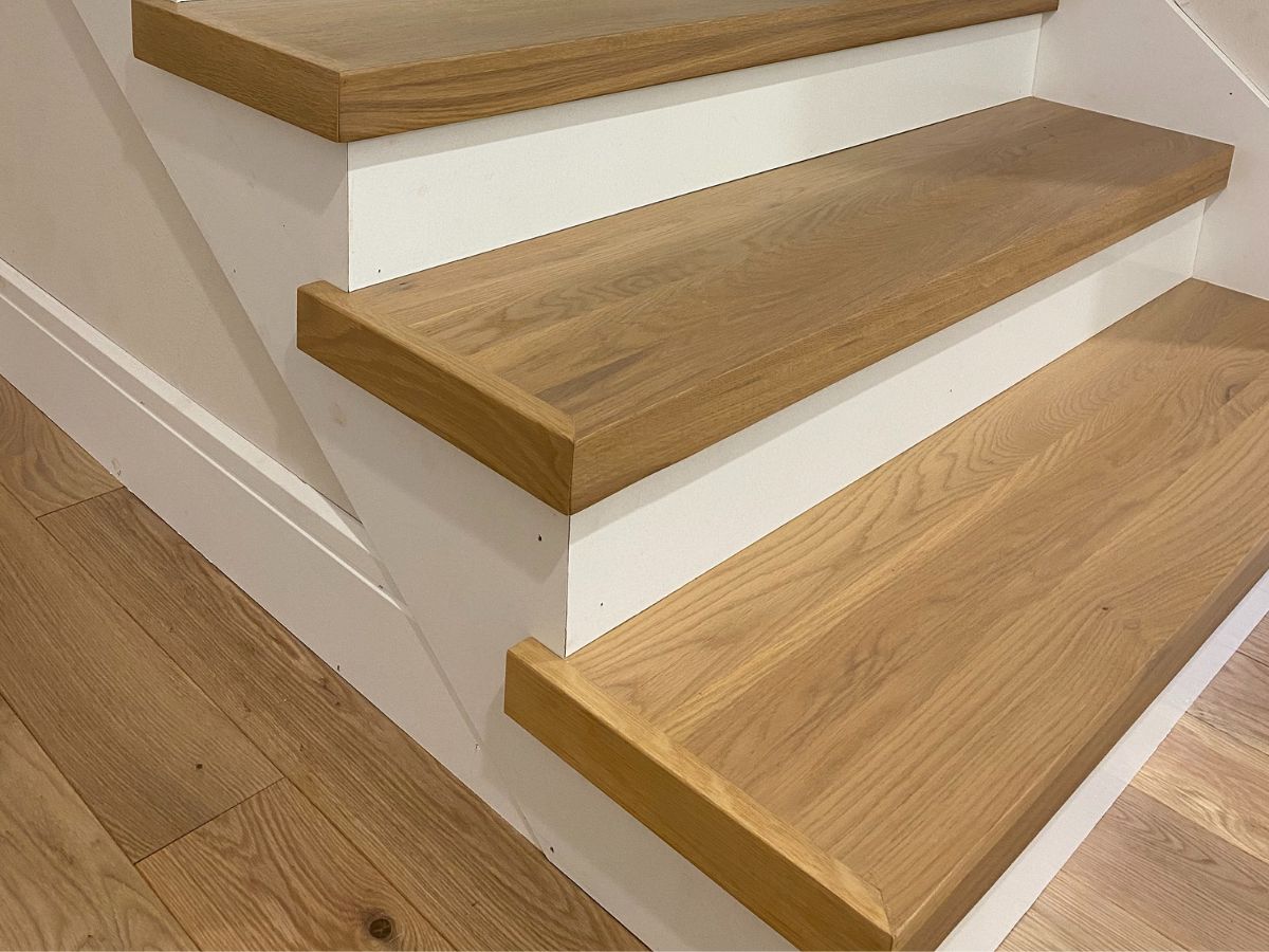 New hardwood stairs installation with matching treads and risers in Bellevue WA